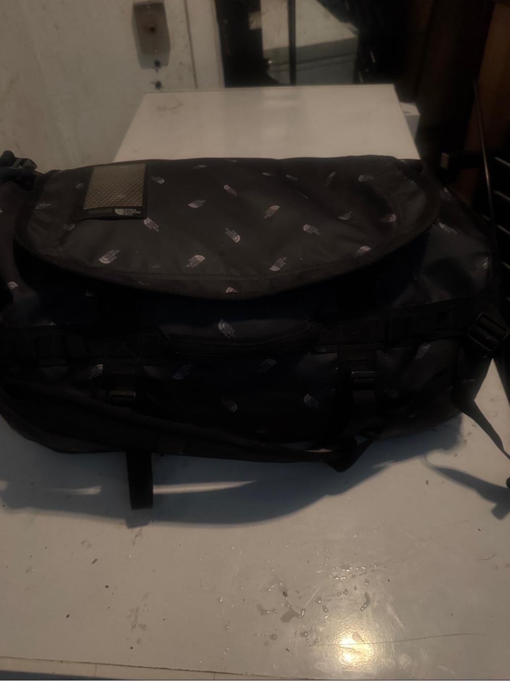 The North Face limited edition Black Duffel Messenger Bag with TNF logo repeat